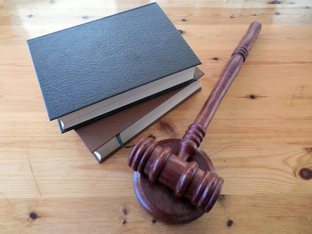 Gavel and law books on a wooden table, symbolizing workers' compensation legal process