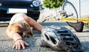 A woman involved in a bicycle accident.