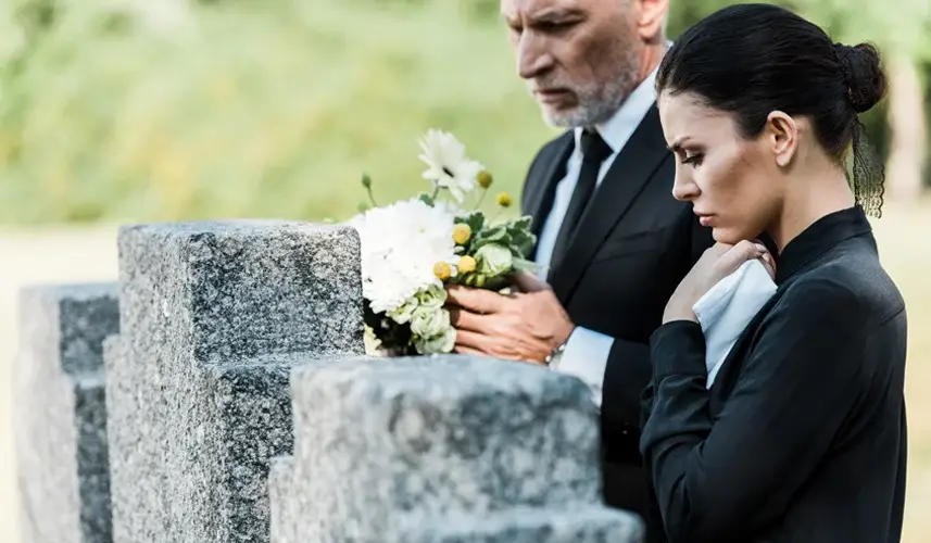a weeping woman and man dealing with wrongful death