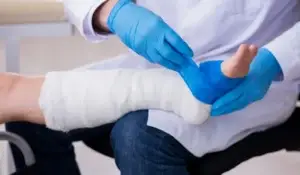 A nurse wrapped an injured leg.