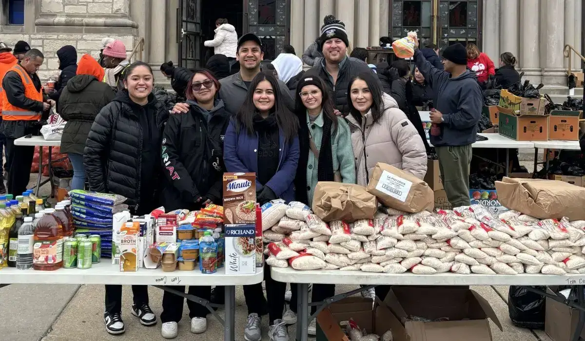 Volunteers from Costa Ivone donating turkeys and meals at St. Rita Parish's Thanksgiving Turkey Giveaway in Chicago.