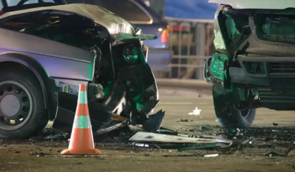 Damaged cars involved in rideshare accidents on a busy street in Chicago, highlighting the aftermath of a collision.